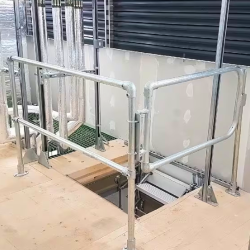 Self closing gate in an industrial setting