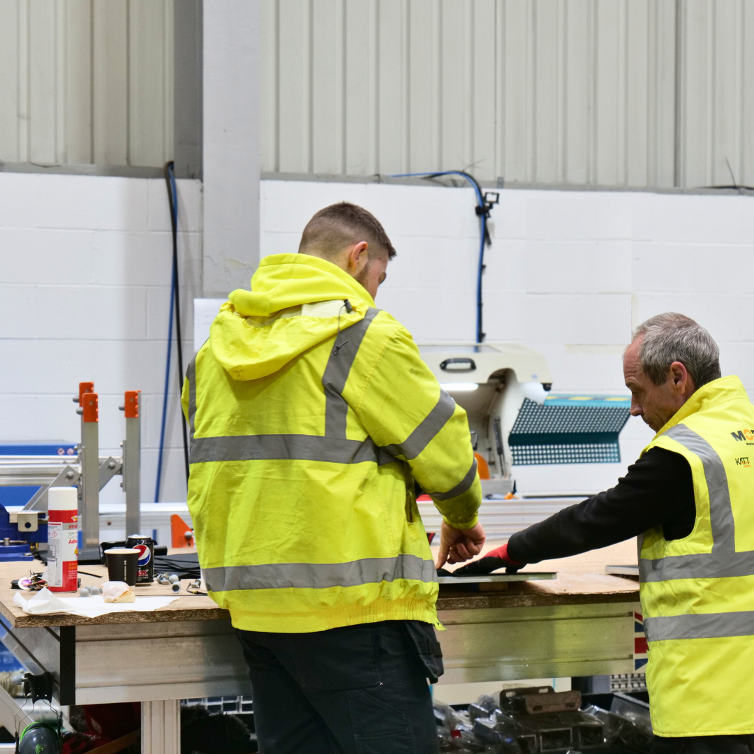 Two men working on a project in the factory